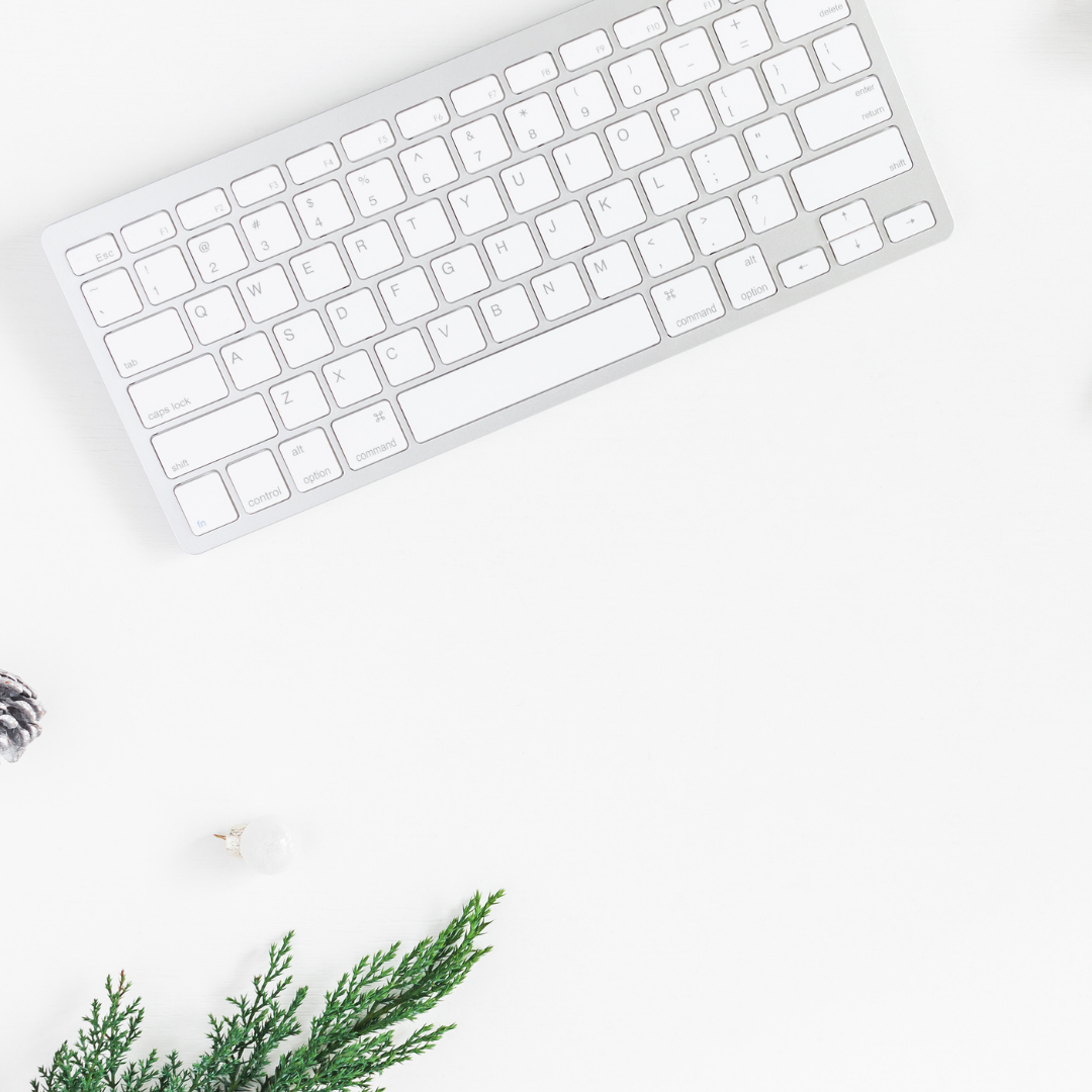 apple keyboard on white desk; blog: Avoid These Common Instagram Giveaway Mistakes During Black Friday and Cyber Monday