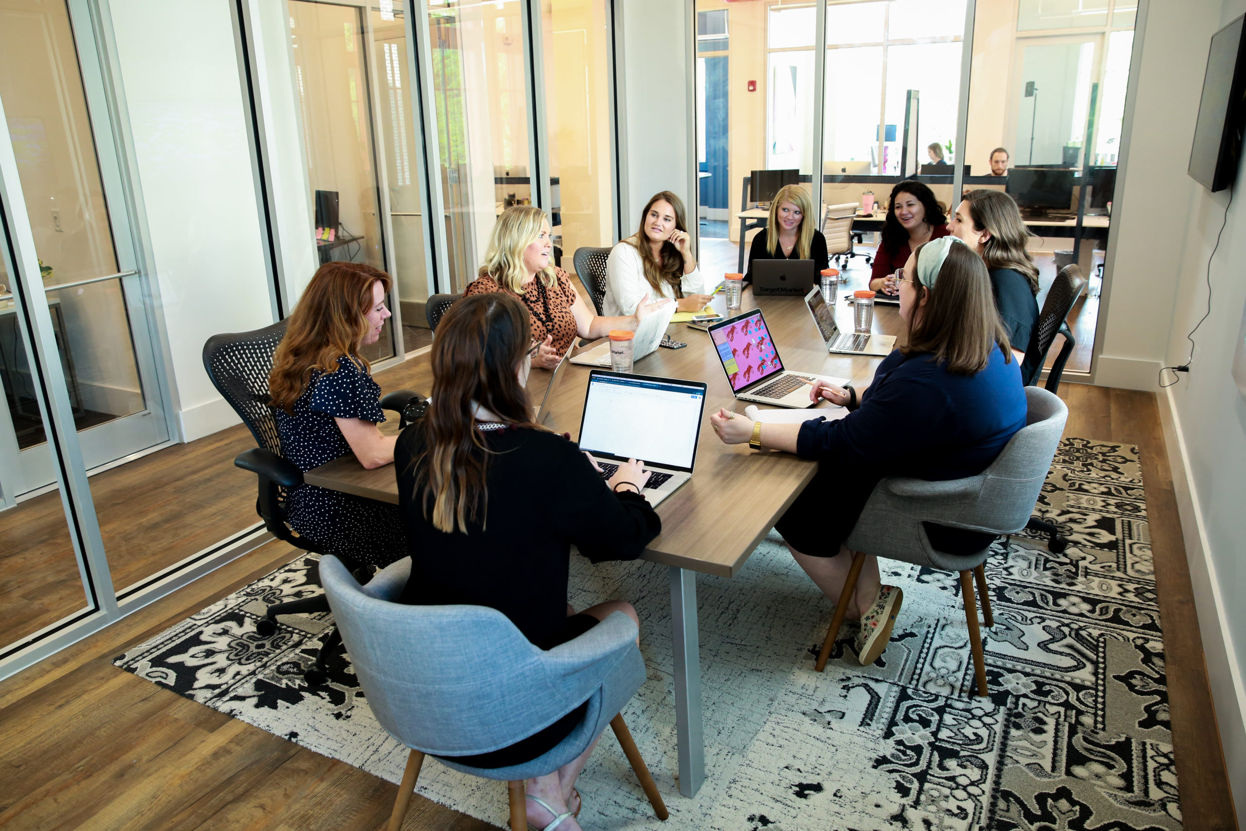 Group of women sitting around conference table in TargetMarket's office